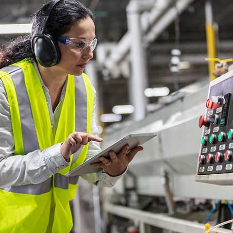 Maintenance manager checks machine settings