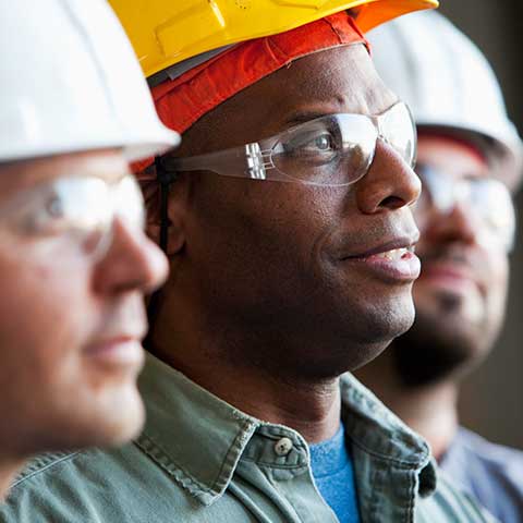 3 employees in an industrial setting